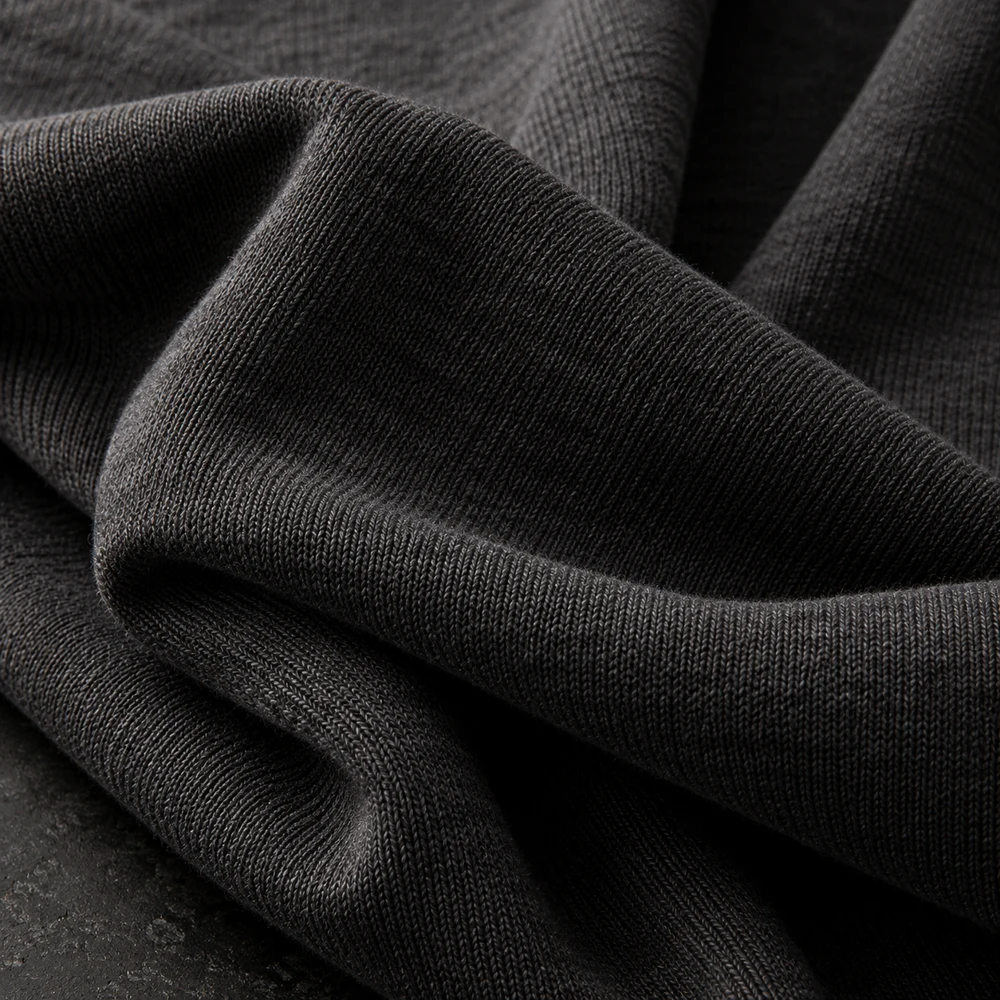 Charcoal cotton jersey folded to show knit texture